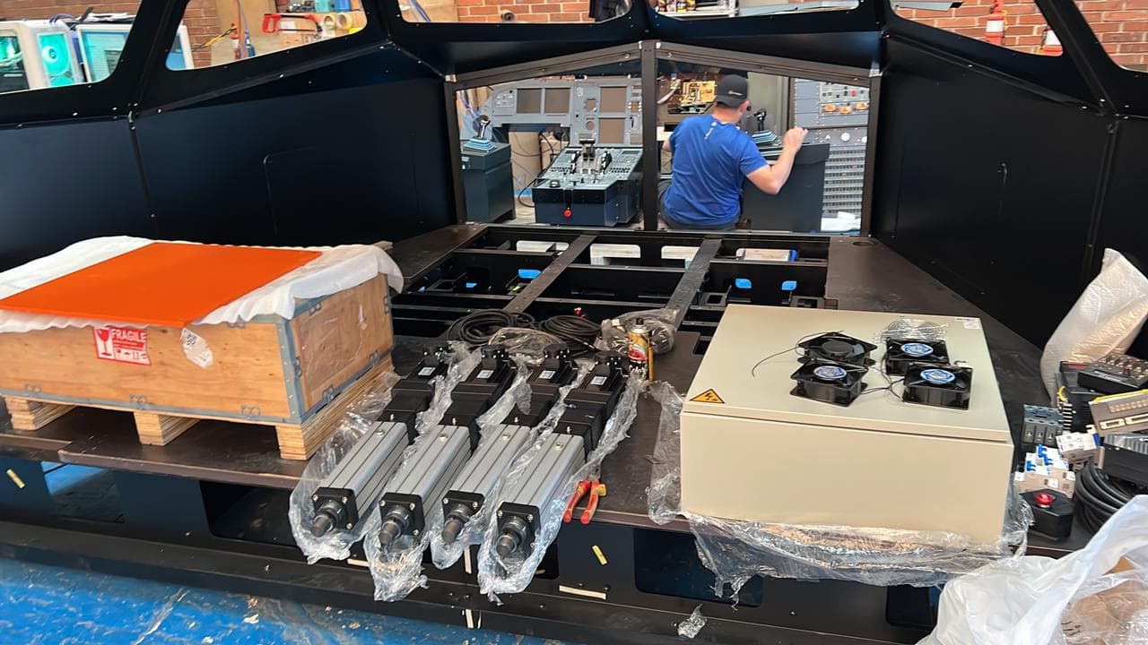 Cockpit fabrication and simulator system integration work